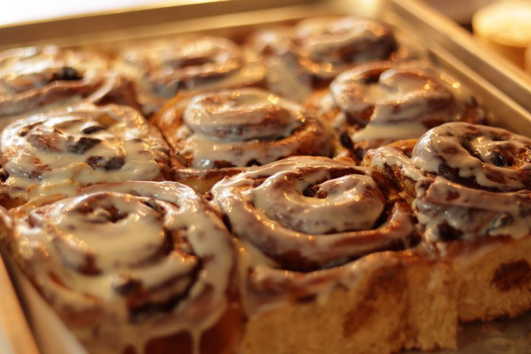 Fresh cinnamon buns with icing on top 